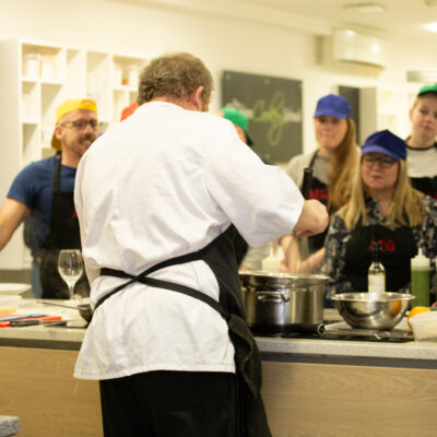Chef demonstrating to team at Cheshire Cookery School